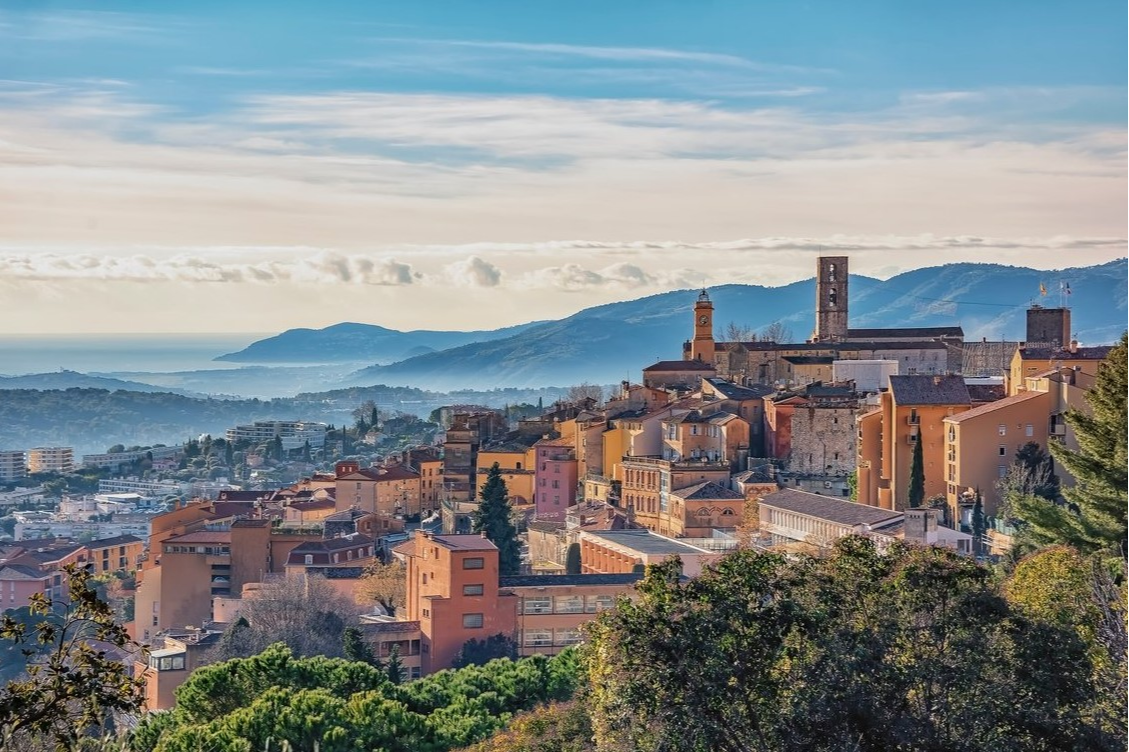 Orange-toned Provençal buildings at Club Med Opio with panoramic views of the green mountains in the background. Orange-toned Provençal buildings at Club Med Opio with panoramic views of the green mountains in the background.