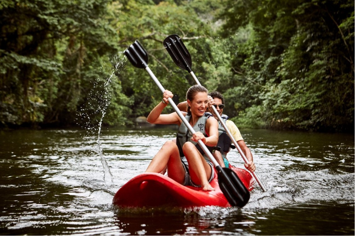Couple kayaking and exploring the ocean and surrounding tropical jungle at Club Med Rio Das Pedras. Couple kayaking and exploring the ocean and surrounding tropical jungle at Club Med Rio Das Pedras.