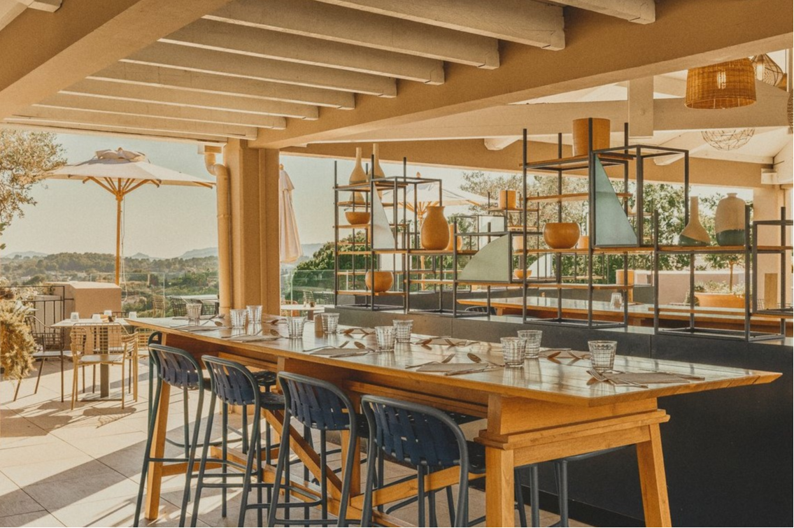 Bistro-style table on the panoramic terrace of La Provence restaurant at Club Med Opio in Provence, perfect for dining together. Bistro-style table on the panoramic terrace of La Provence restaurant at Club Med Opio in Provence, perfect for dining together.